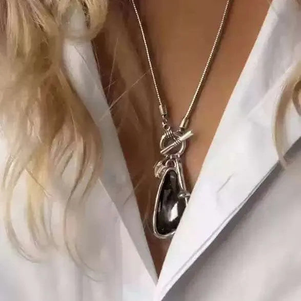 Long alloy snake bones chain necklace with a geometric plaid pendant for women