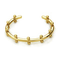 Stainless steel C-shaped bracelet with rivet-shaped bean beads in a steel-gold colour finish.