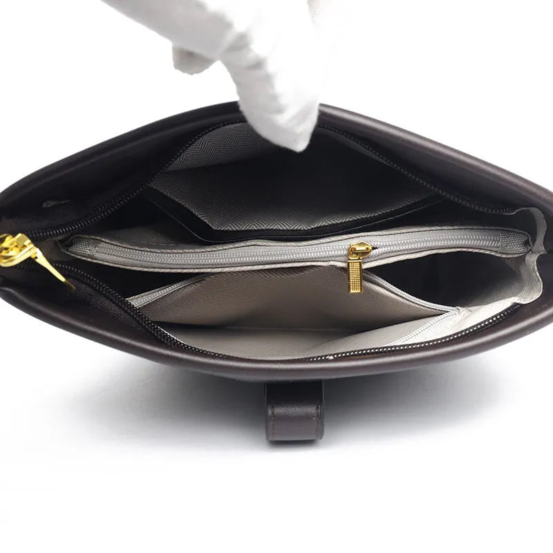 Korean style black bucket messenger bag with double shoulder straps and multiple interior compartments