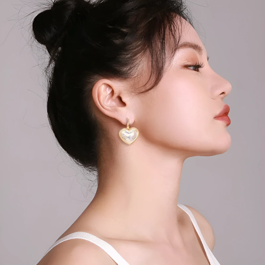 A pair of gold-coloured alloy ear clips for women in a natural style.