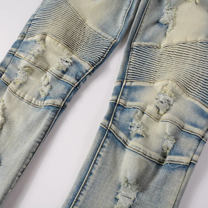 Light blue distressed slim fit men's jeans with hand-frayed details and straight leg opening