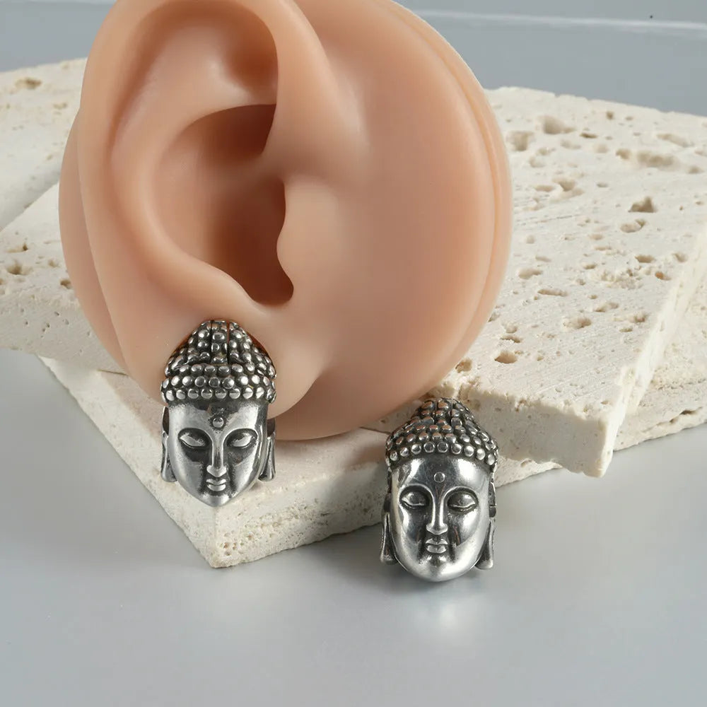 Stainless steel hollow skull Buddha earrings showing four electroplated colour options