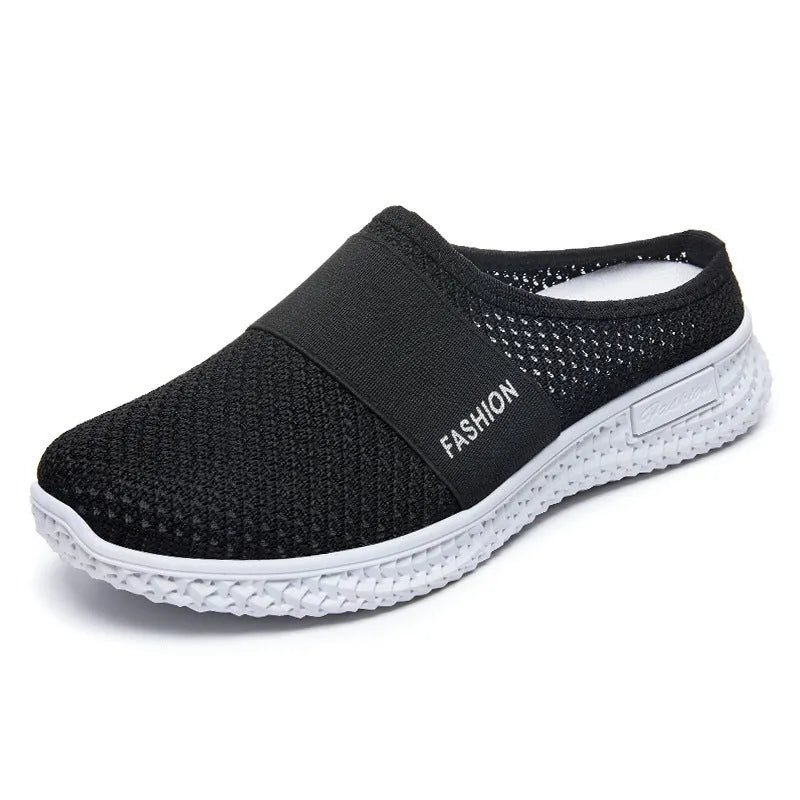 Women's casual flat shoes with mesh upper and hollow-out design in black, grey, pink, or purple.