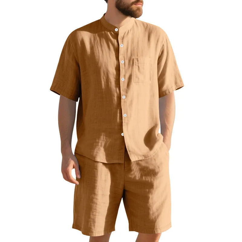 Men's light blue linen two-piece suit with Henry collar, short sleeves, and matching shorts for summer wear