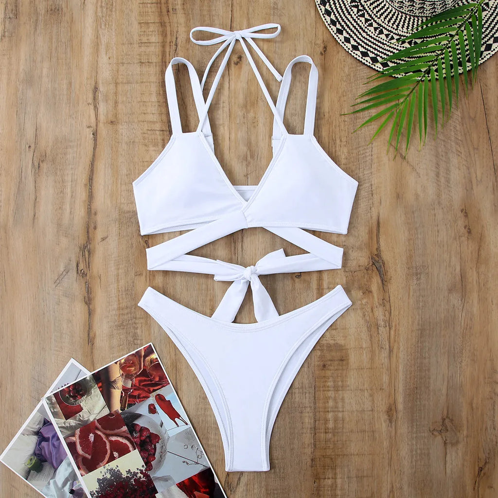 Women's solid colour bikini swimsuit with adjustable ties on the triangle top and brief bottoms.
