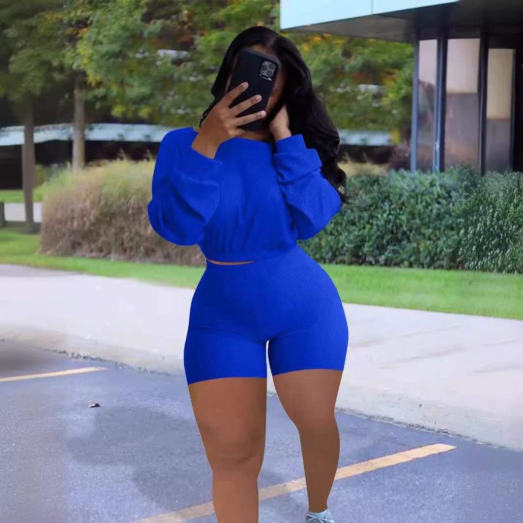 Women's off-the-shoulder long sleeve top and matching shorts in a sunken stripe solid colour two-piece set.