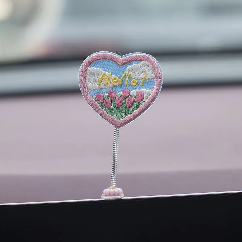 Set of six small yellow PVC duck figurines and one Hello sign for car dashboard decoration.