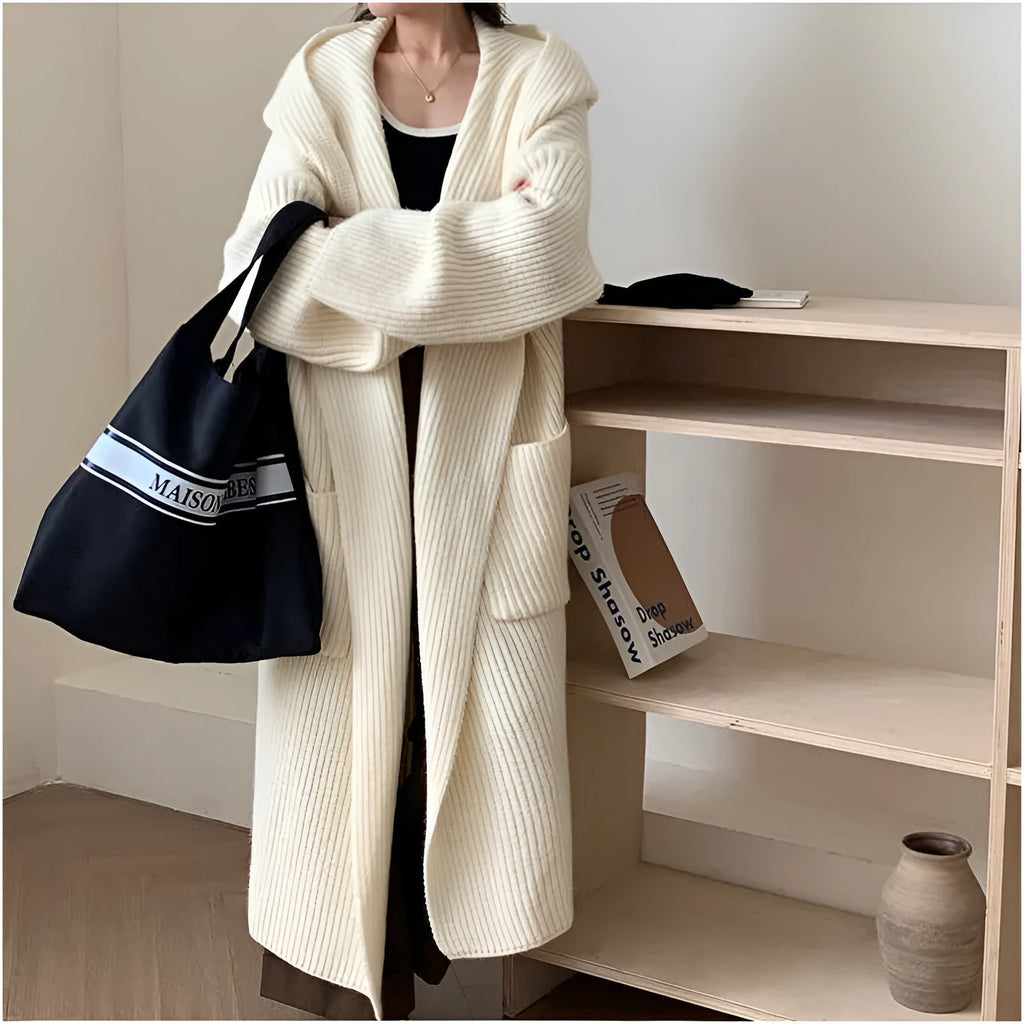 Loose hooded acrylic cardigan coat with extended length and raglan sleeves