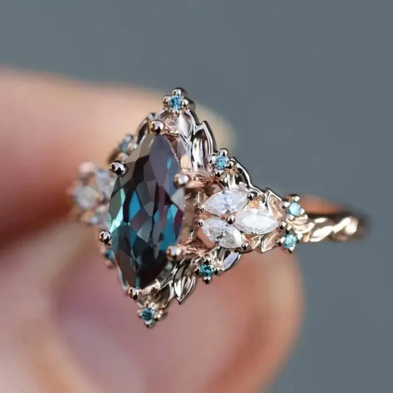 Rose gold copper ring with hollow out brushed finish and inlaid zircon stones in flower and leaf design