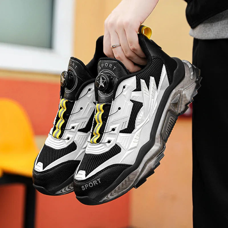 Men's black mesh casual sneakers with a rotating button closure and a low platform sole.