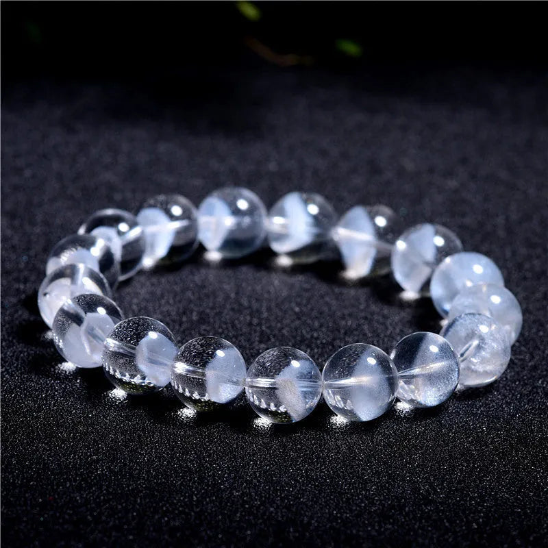 Women's white crystal pyramid ghost bracelet with Ruyi charm showing multiple bead size options