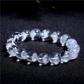 Women's white crystal pyramid ghost bracelet with Ruyi charm showing multiple bead size options