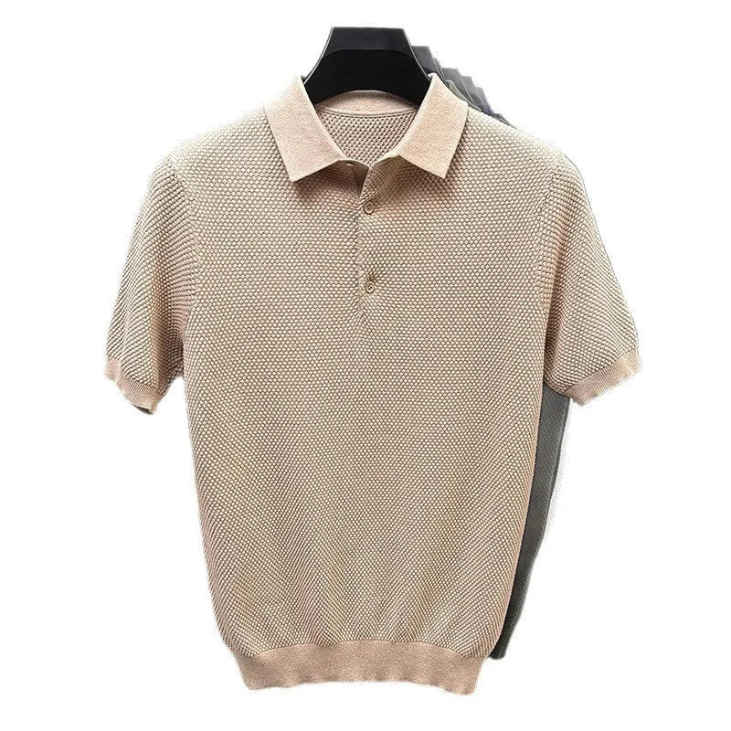 Man wearing a loose grey short sleeve cotton sweater, casual pullover style