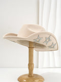 Denim top hat made from woolen felt with a conical crown and hexagonal star decoration.