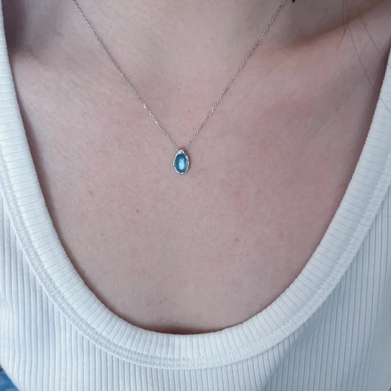Navy blue water drop necklace with geometric pendant on cross chain, adjustable 41-50cm length