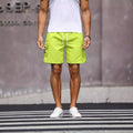 Men's loose fit work shorts in fluorescent green and army green colours with straight cut design