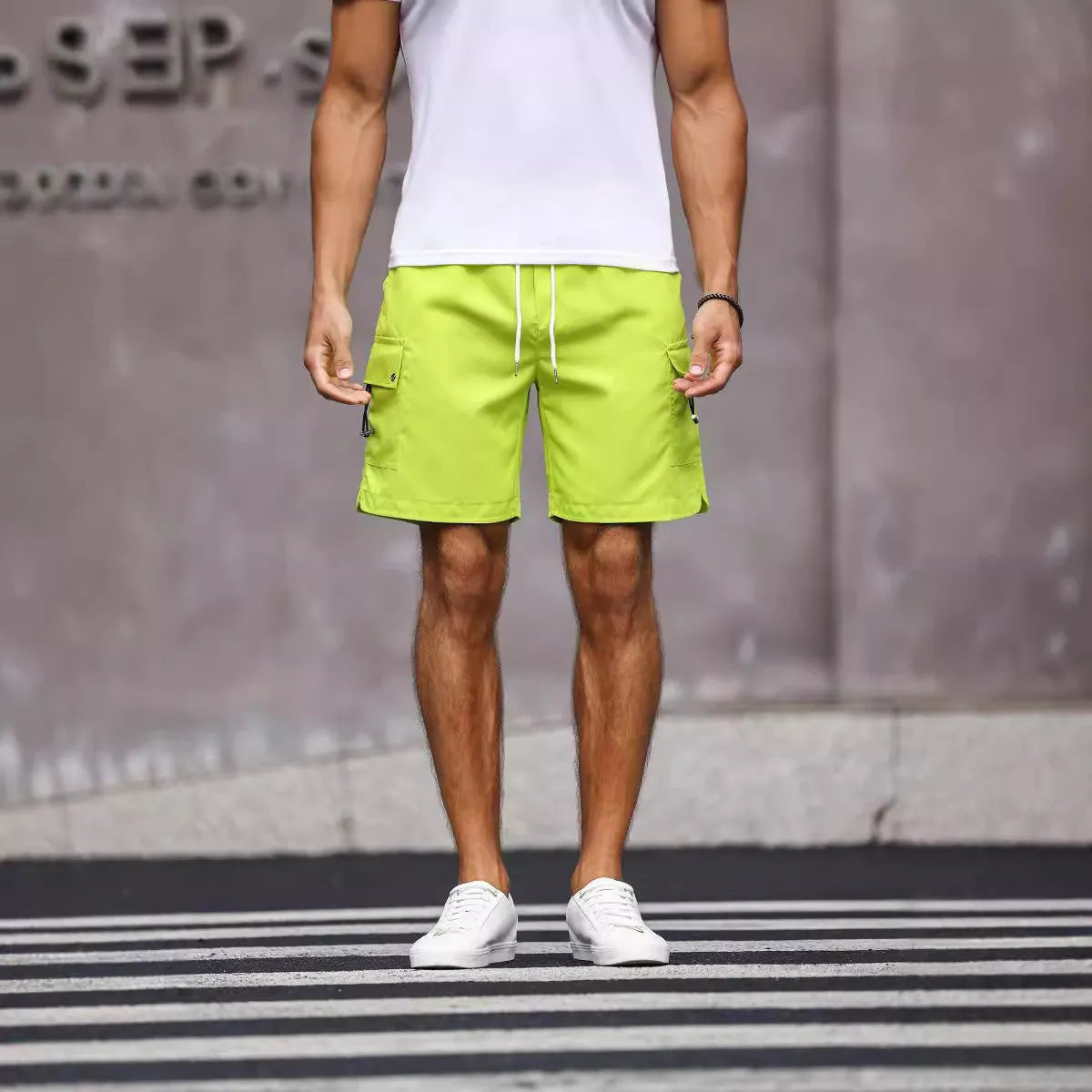 Men's loose fit work shorts in fluorescent green and army green colours with straight cut design