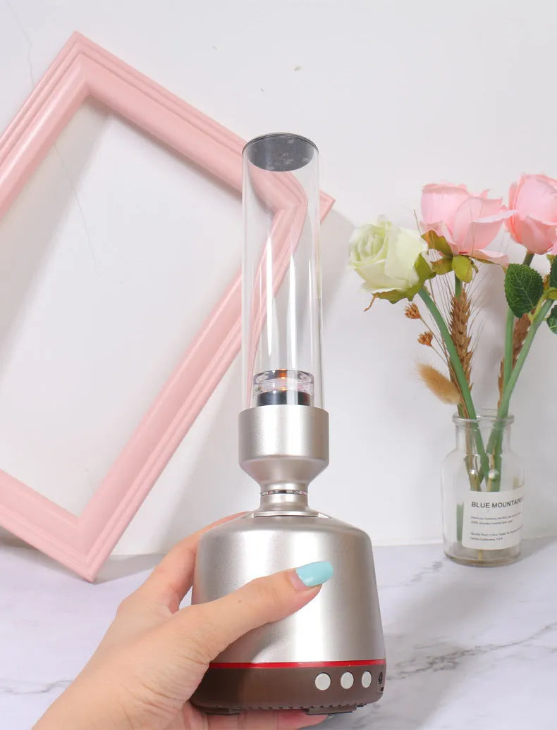 White silver Bluetooth speaker with candlelight atmosphere lighting showing modern minimalist design
