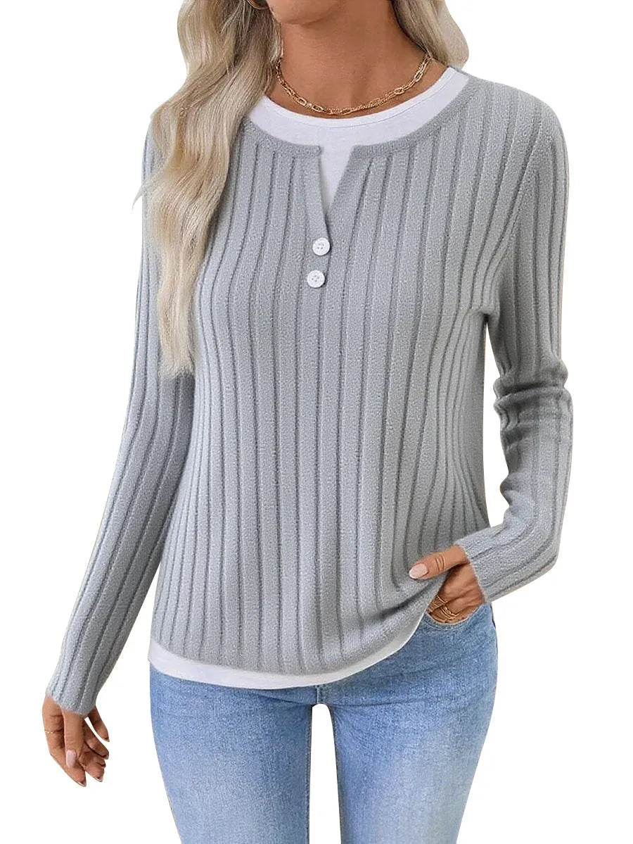 Women's black fake two-piece pullover sweater with a round neck and a button on the shoulder.