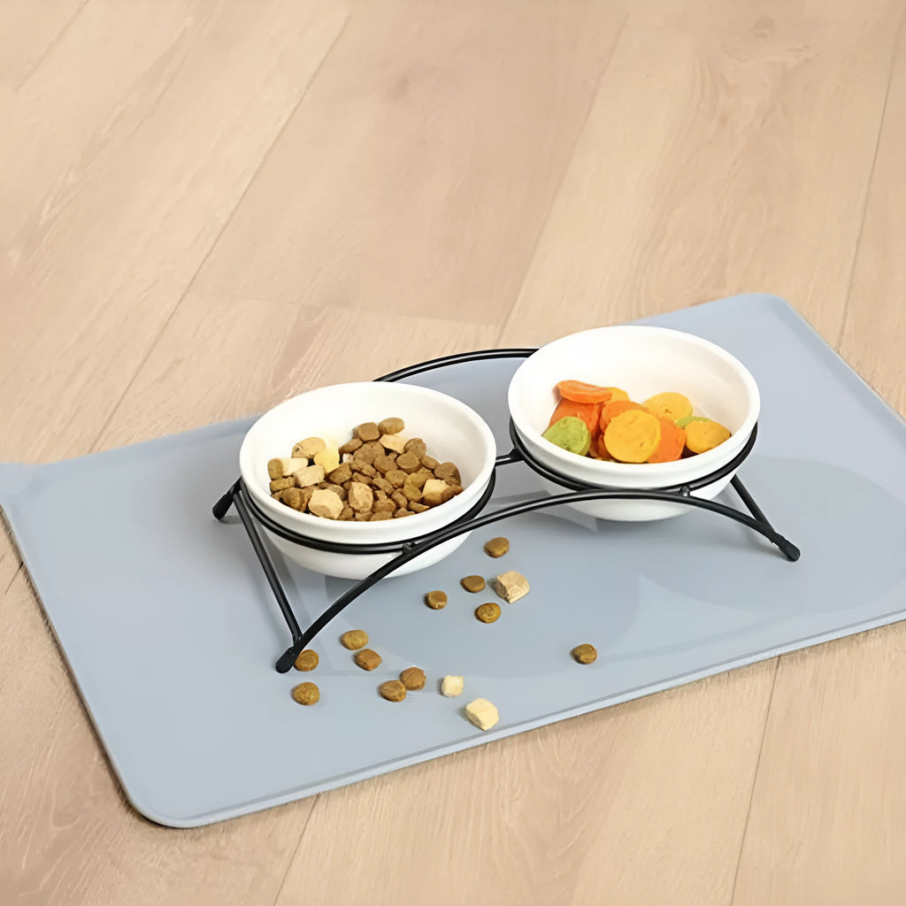 Silicone pet placemat with dog's paw design in gray, for cat and dog food bowls