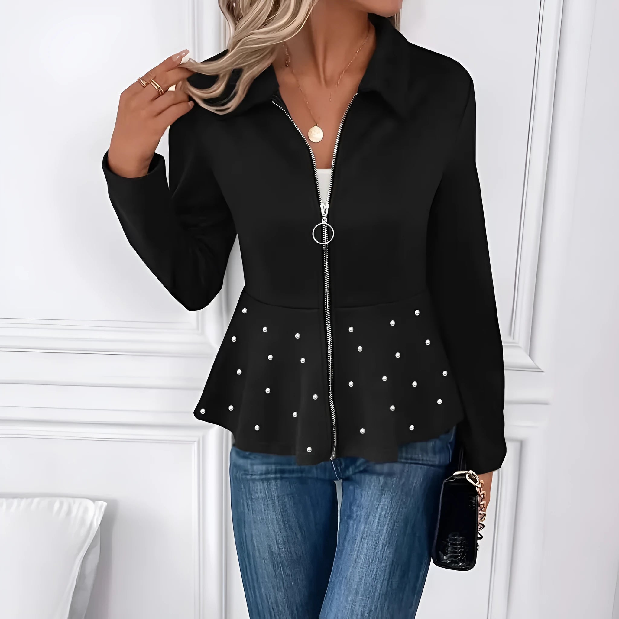 Women's black loose fit coat with heavy-duty zipper and ruffle hem, made from spandex blend fabric.