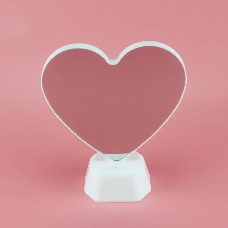 Rose red double-sided love tunnel shaped LED decorative light on a table