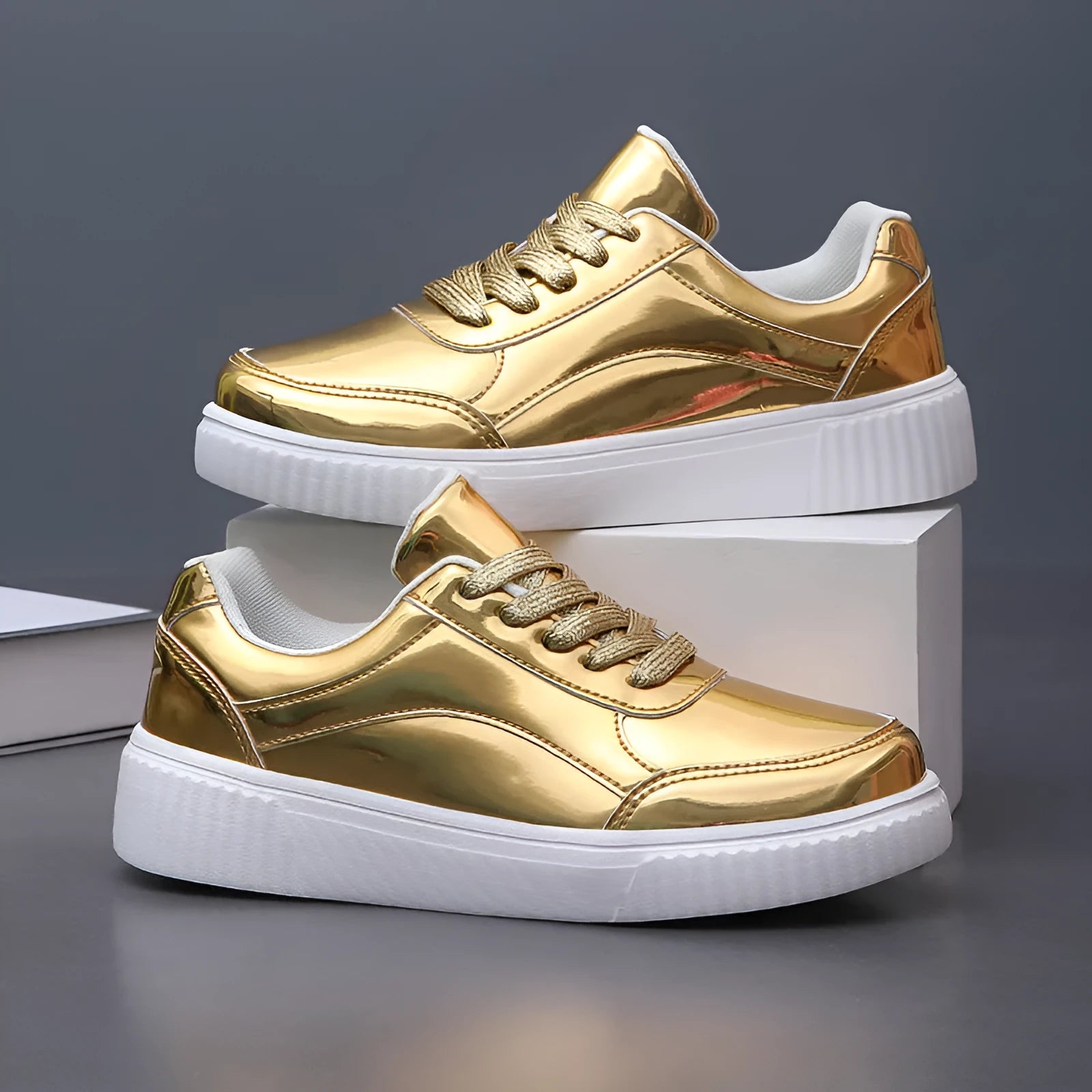Sequin platform sneakers with thick sole in rose gold colour showing round toe and decorative stitching