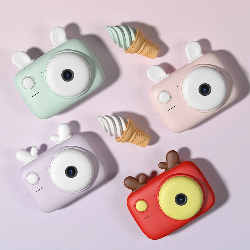 A2 kids digital camera in macaron colours with dual lenses, 2.4-inch screen, and included lanyard.