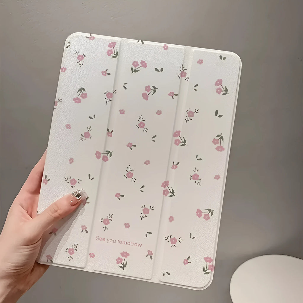 Transparent floral patterned tri-fold iPad case with magnetic stand function showing compatible tablet models