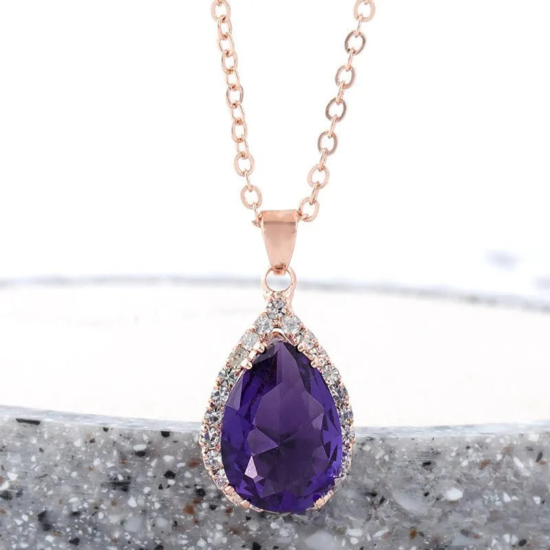 Women's drop shape necklace with rhinestone inlay and geometric design in pink colour option
