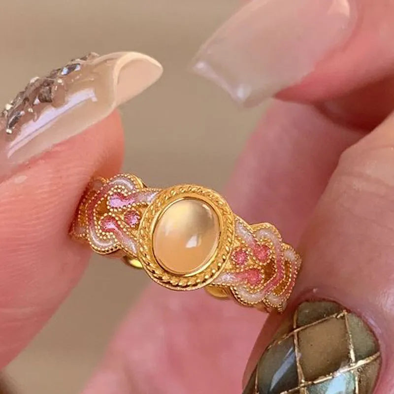Open geometric ring with pink crystal enamel on copper gold plating for women