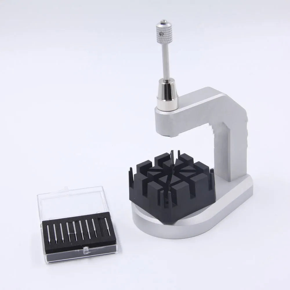 Silver tool steel multi-purpose press strap removal tool for watch and jewellery repair.