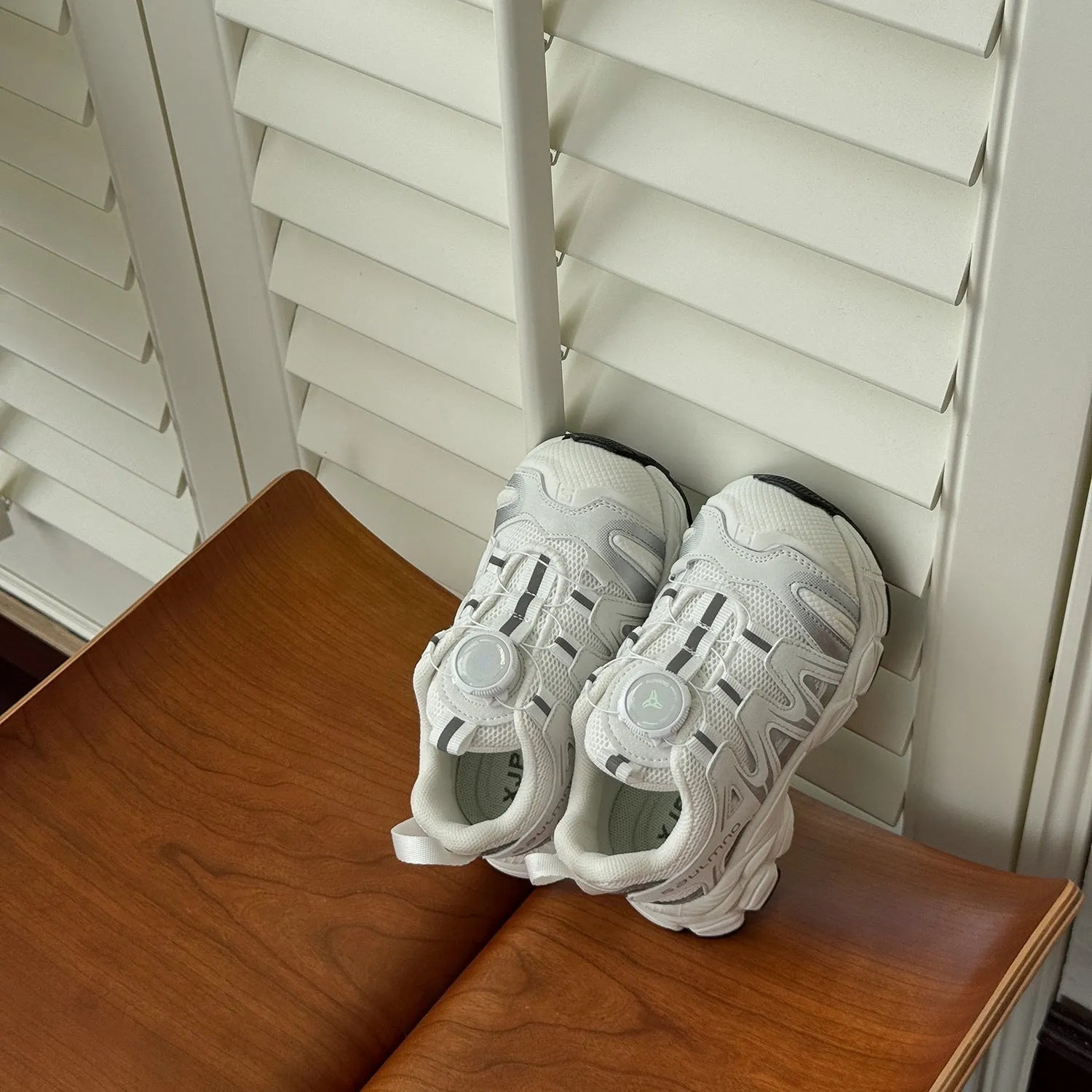 Kids' casual shoes in black, beige, or pink with a lightweight PU leather mesh upper.
