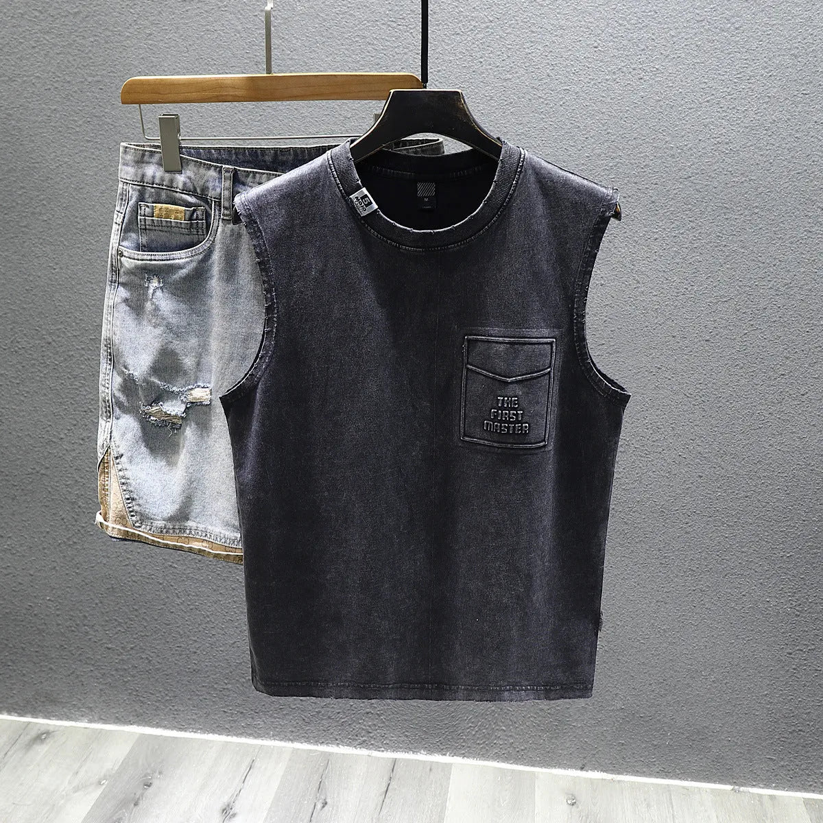 Cotton sleeveless fitness t-shirt in solid black colour showing loose fit and straight hem design