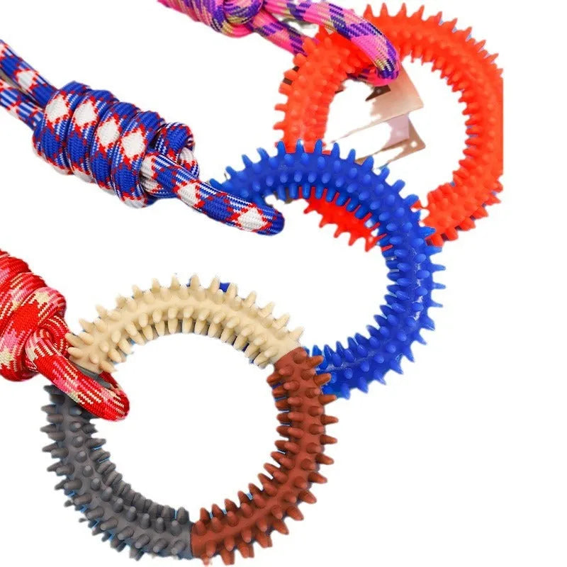 Blue braided rope dog toy with knots, shown next to a red and a rose red version for size comparison.