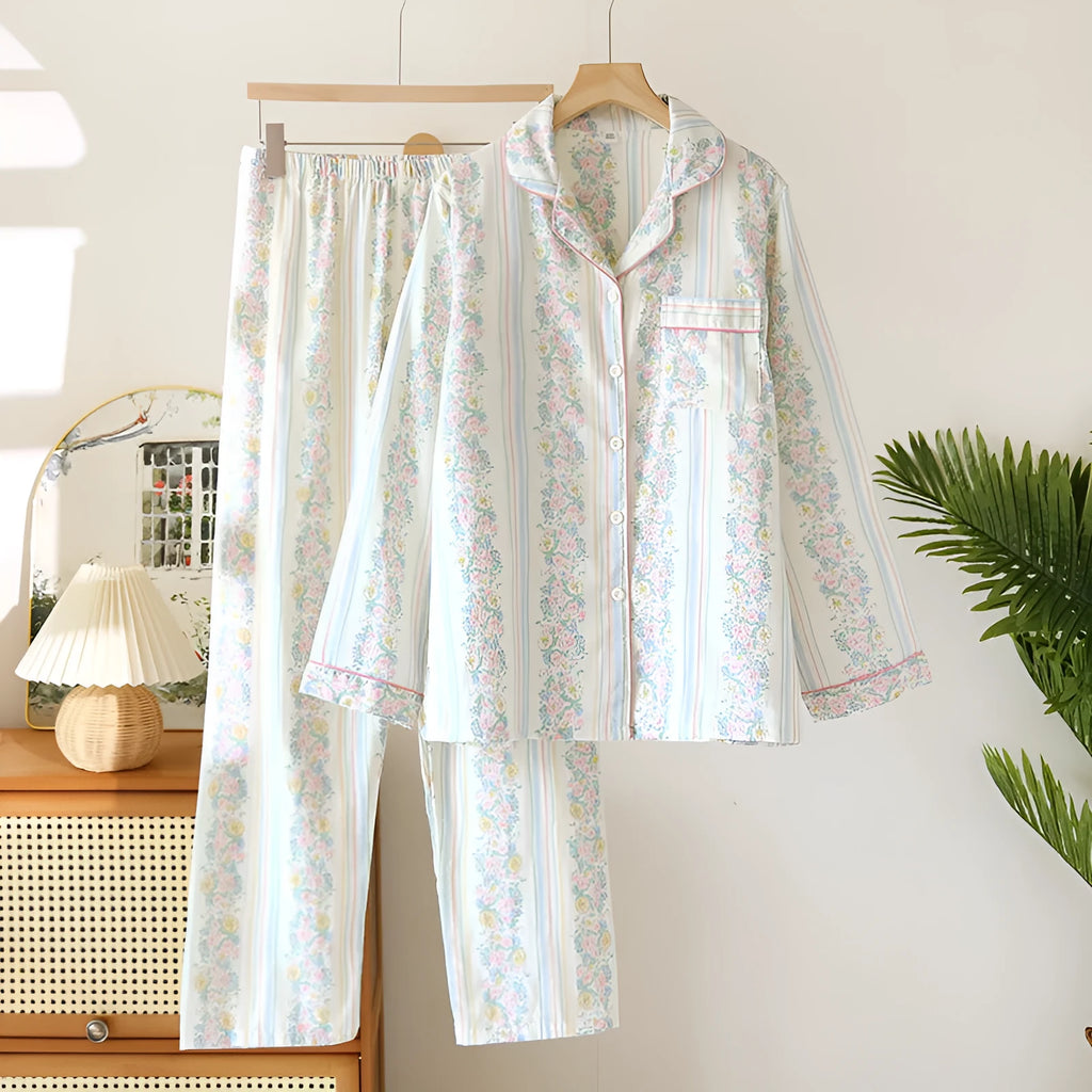 Women's red small fruit print cotton gauze long-sleeved pyjama top and trousers set laid flat.