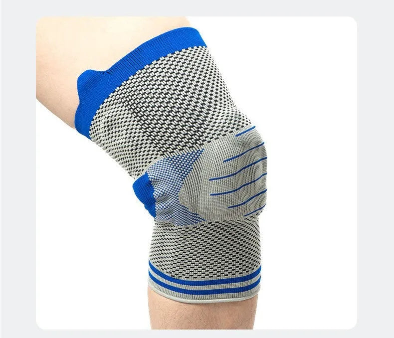 A black and grey cotton knee pad showing a silicone massage spring bar shock absorber on the knee area.
