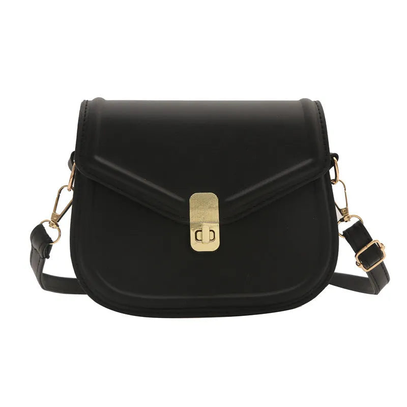 PU leather soft shell messenger bag with clamshell opening in a horizontal square shape.