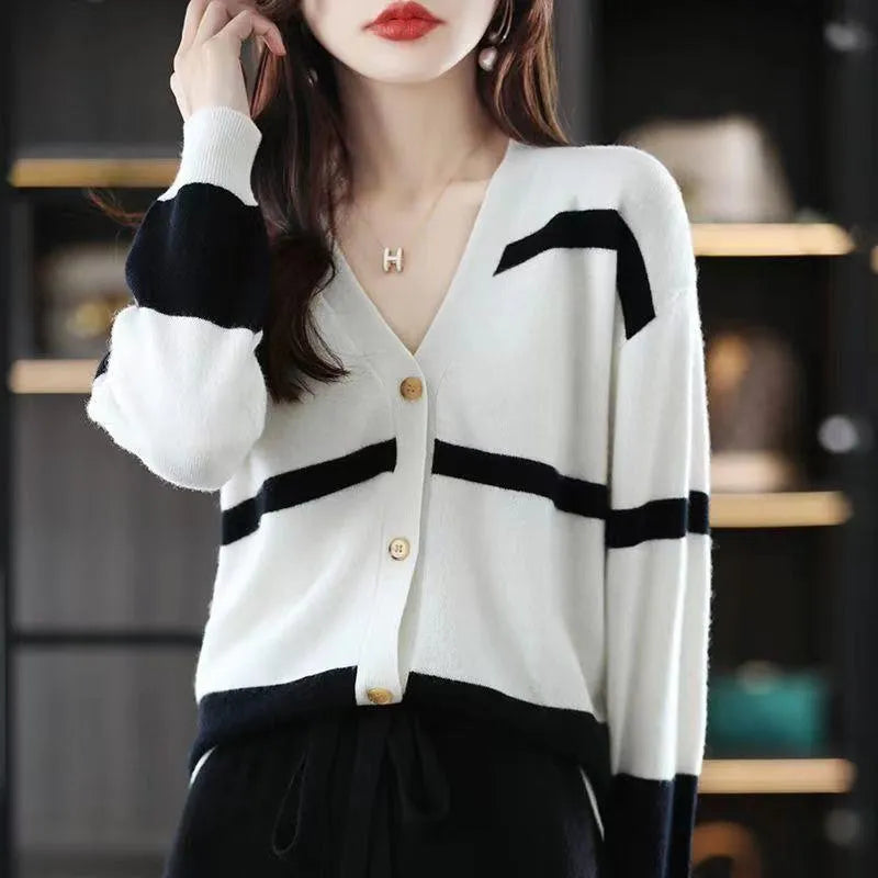 Women's slim-fit V-neck cardigan with 3D striped pattern and button front in assorted colours.