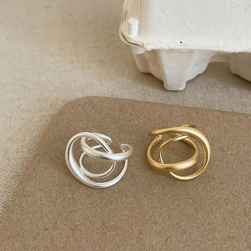 3D interlaced geometric open ring for women in matte metal with gold electroplating