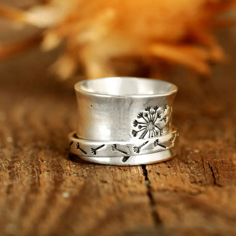 Silver electroplated rotatable flower ring showing floral design on alloy band
