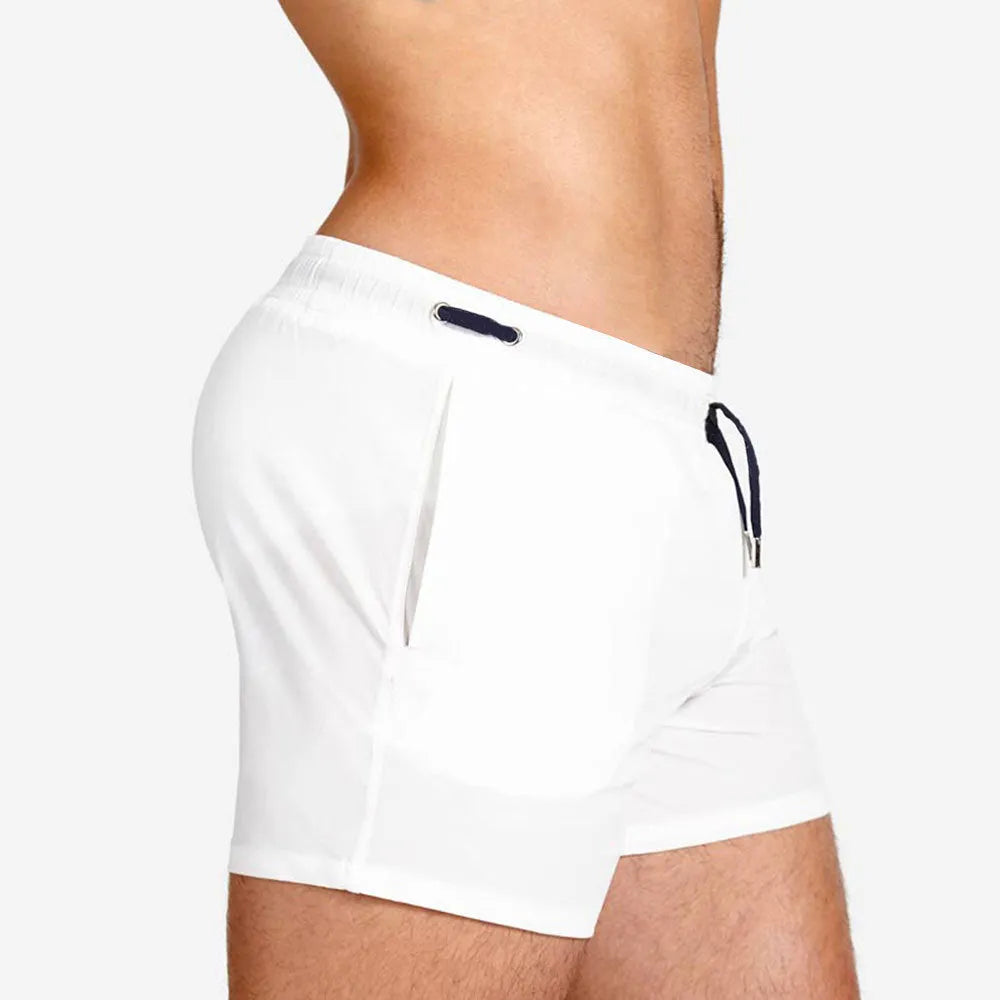 Mesh lining polyester sports shorts in army green, shown flat.
