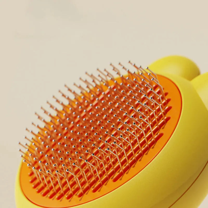 Self-cleaning pet brush with release button, stainless steel comb with rubber-tipped needles