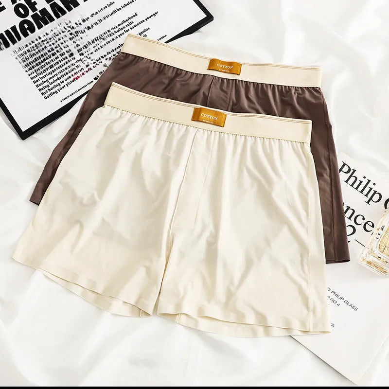 Three pairs of solid colour men's ice silk boxer shorts in loose fit mid-waist design