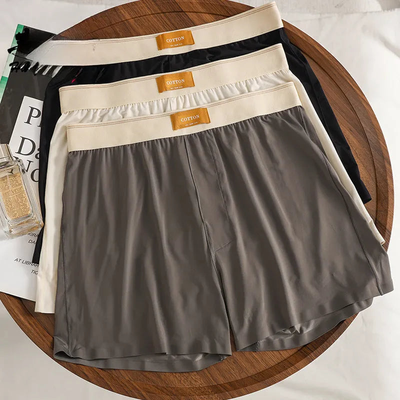 Three pairs of solid colour men's ice silk boxer shorts in loose fit mid-waist design