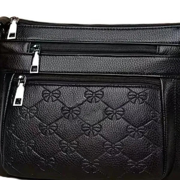 Women's butterfly black PU leather messenger bag with adjustable strap and phone pocket