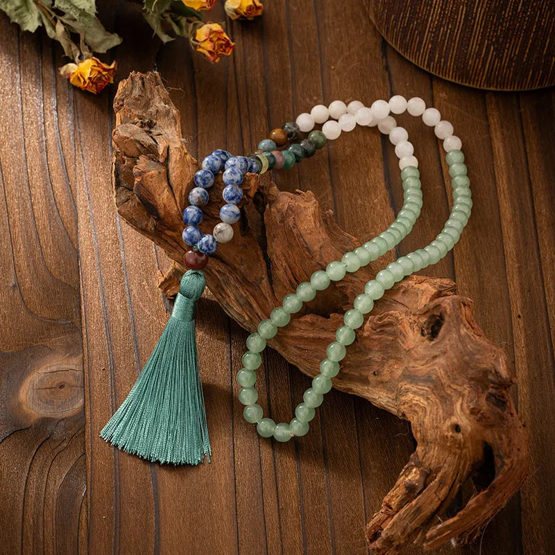 Vintage bohemian style beaded chain necklace with geometric round beads and tassel details