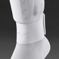 Elastic rubber strap for securing football shin guards, shown in blue colour.