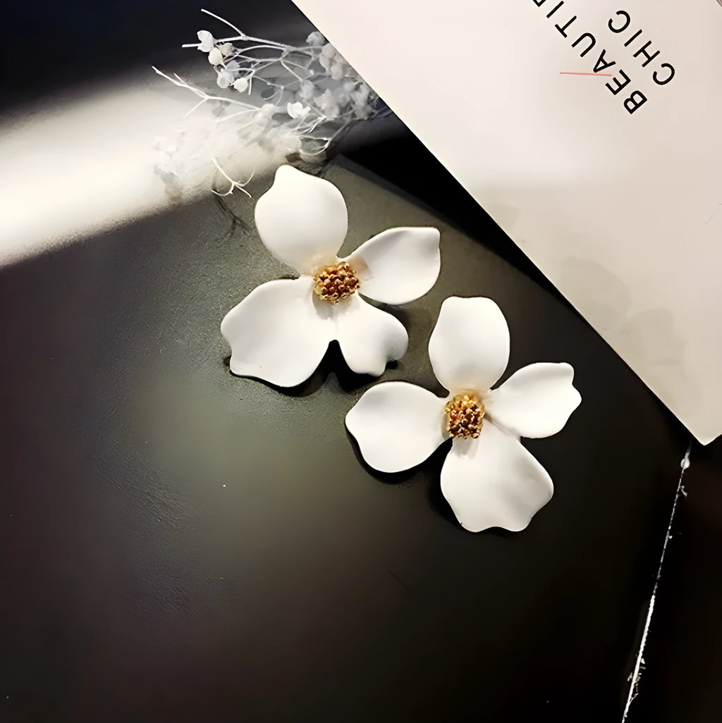 Flower-shaped alloy stud earrings with electroplated pink or white finish and clutch backings