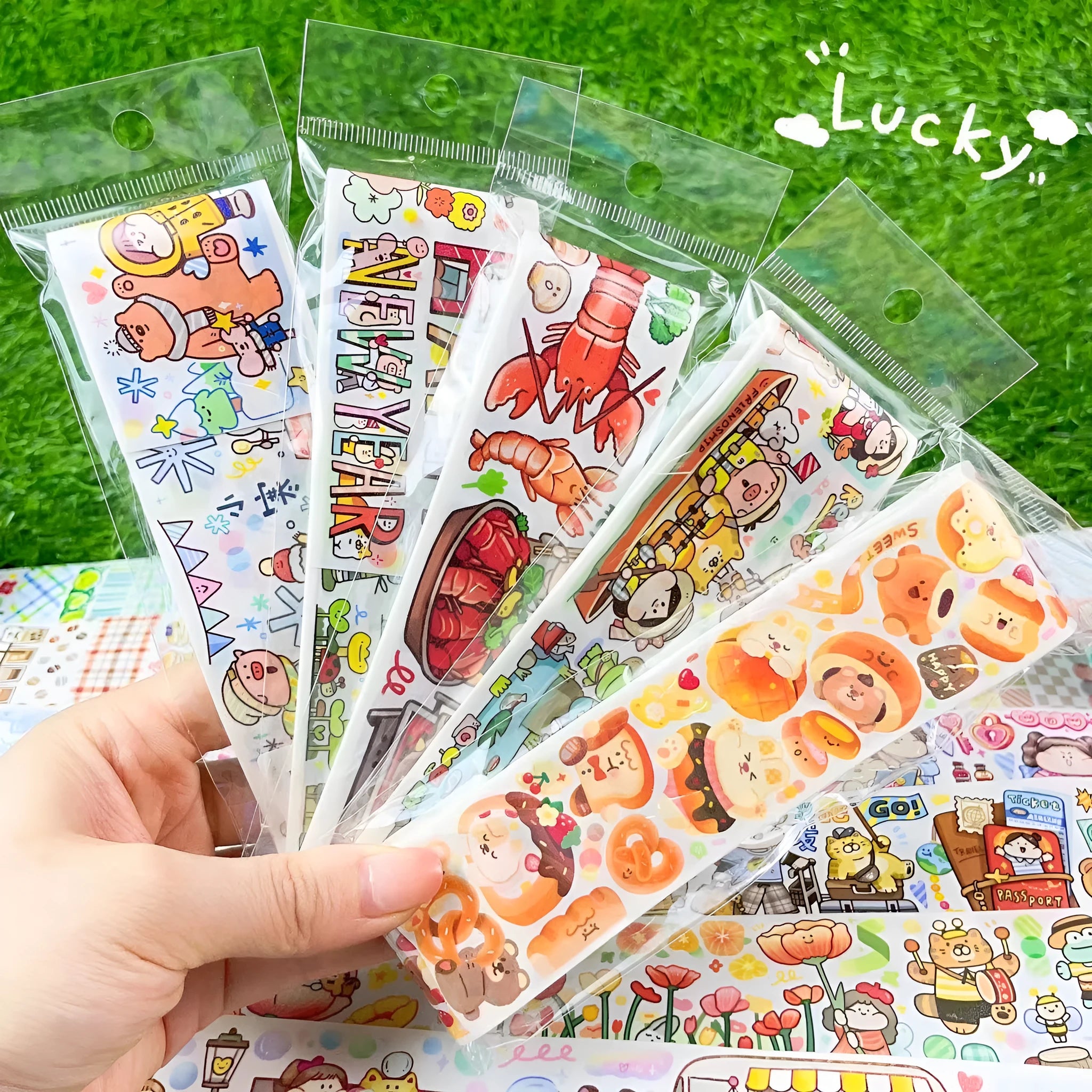 Sheet of cute cartoon character stickers on Japanese paper for haemorrhoid tape packaging labelling.